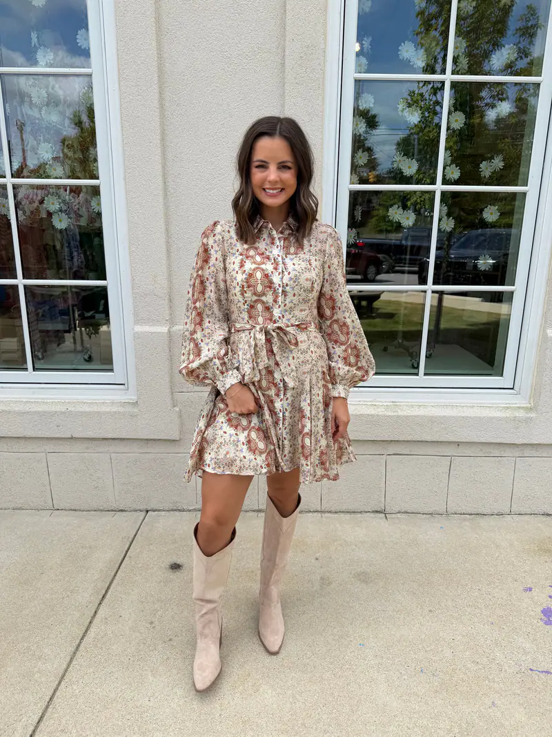 Madison wearing a cream and rust button-down mini dress