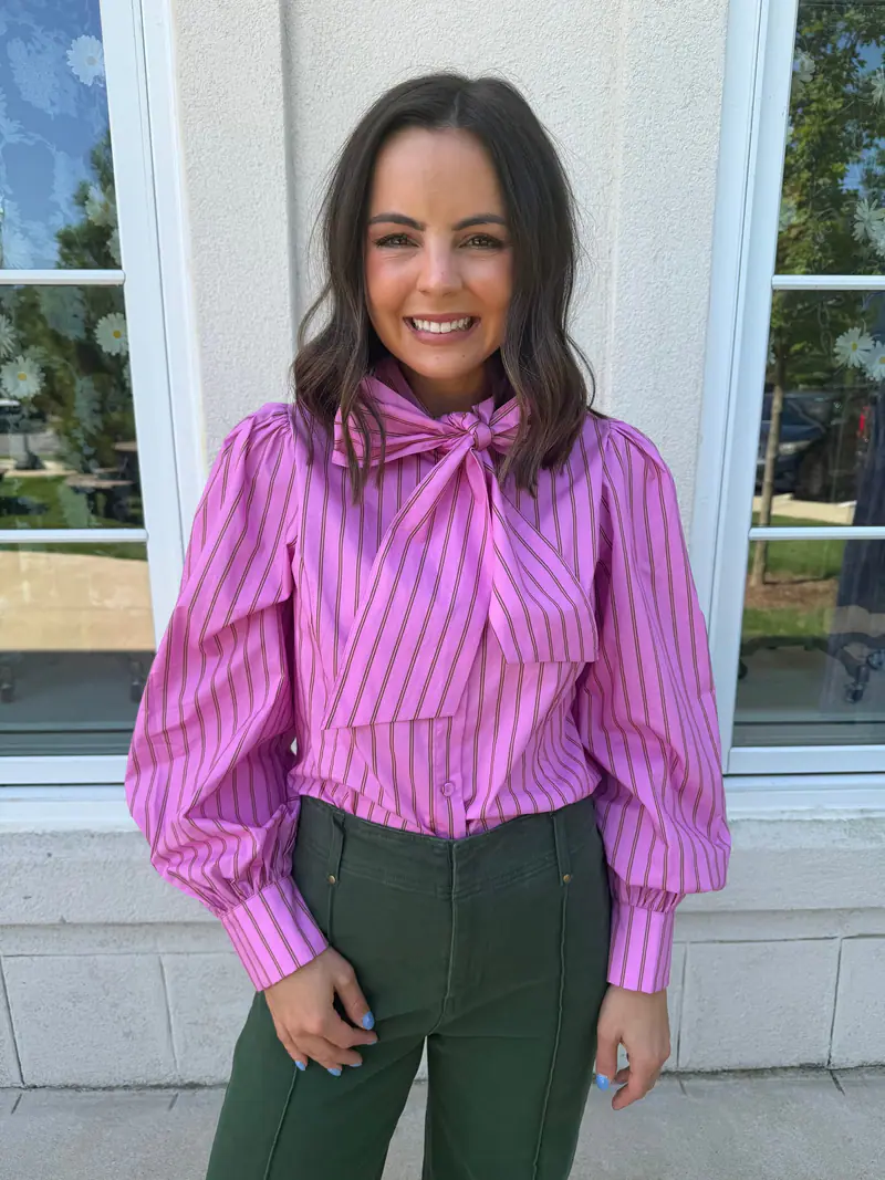 Woman wearing a pink striped top