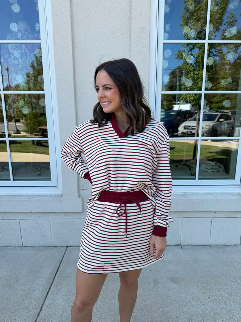 Woman wearing a wine striped knit set